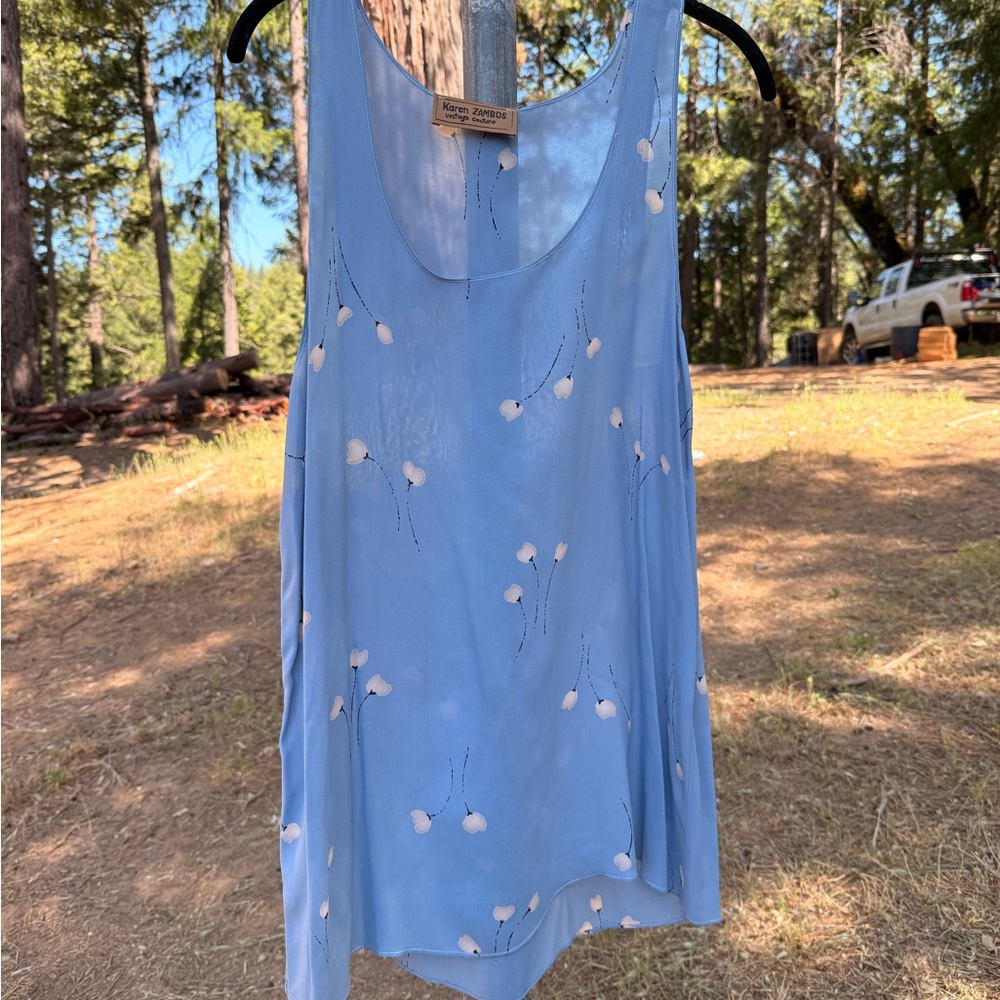 Light Blue Sleeveless Dress with White Floral Print